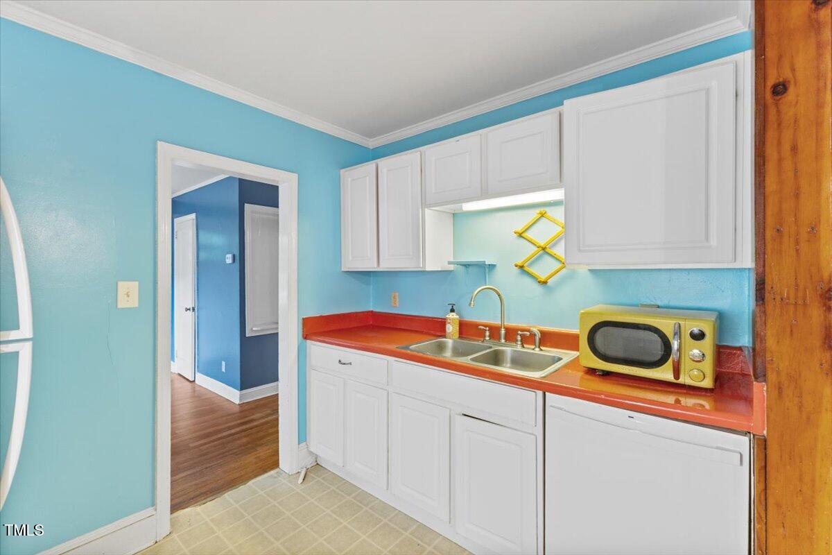 2324 Stevens Road Raleigh, NC 27610 - Photo 24 of 50 a room with a sink and cabinets