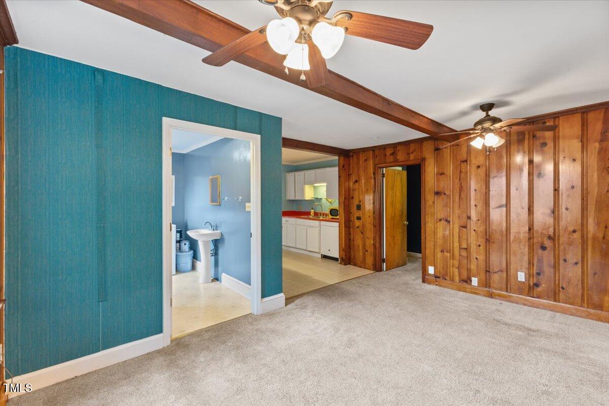 2324 Stevens Road Raleigh, NC 27610 - Photo 26 of 50 a view of a hallway with wooden shelves