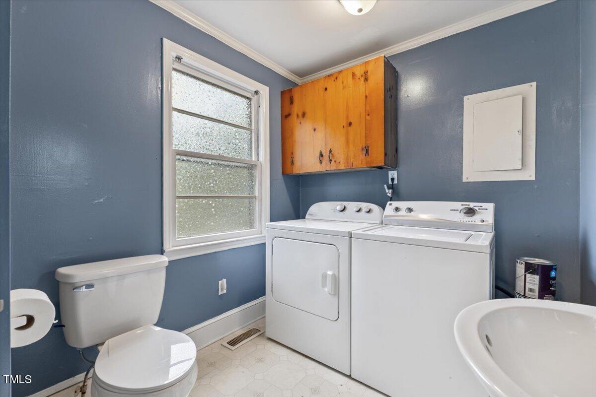 2324 Stevens Road Raleigh, NC 27610 - Photo 28 of 50 a bathroom with a toilet sink and mirror