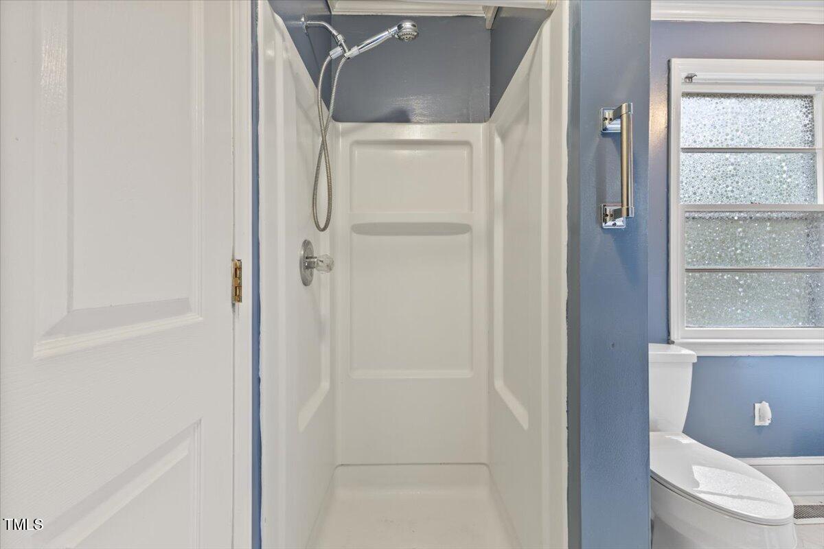 2324 Stevens Road Raleigh, NC 27610 - Photo 29 of 50 a bathroom with a shower and a toilet