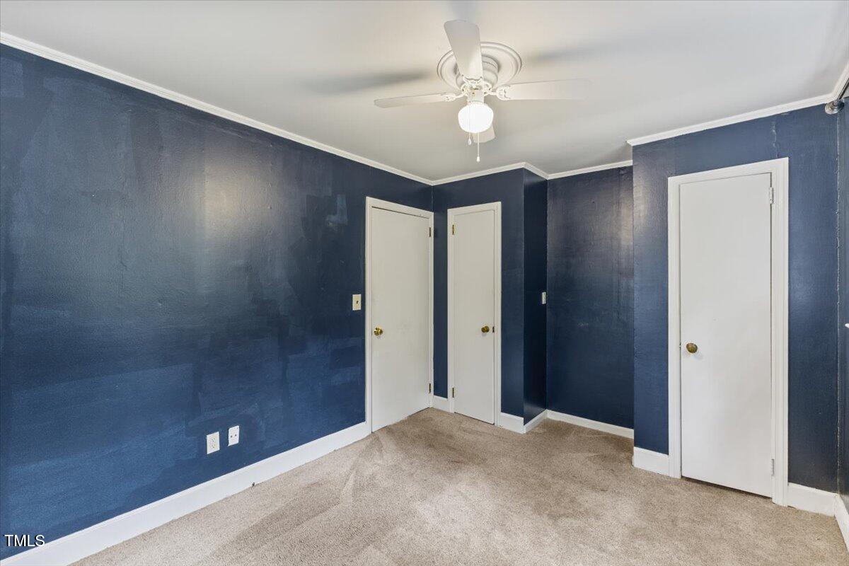 2324 Stevens Road Raleigh, NC 27610 - Photo 33 of 50 a view of an empty room with a chandelier fan