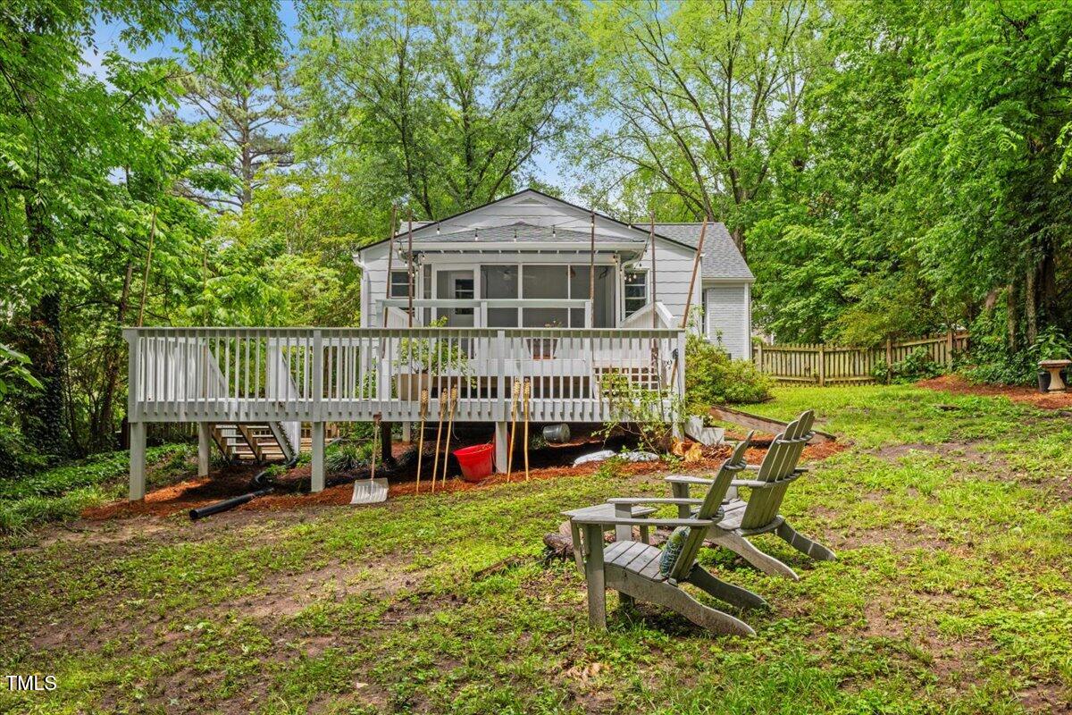 2324 Stevens Road Raleigh, NC 27610 - Photo 45 of 50 a view of a chair and table in backyard of the house