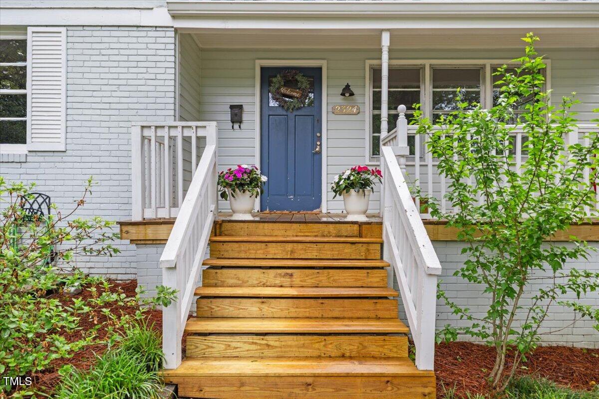 2324 Stevens Road Raleigh, NC 27610 - Photo 5 of 50 a front view of a house with potted plants