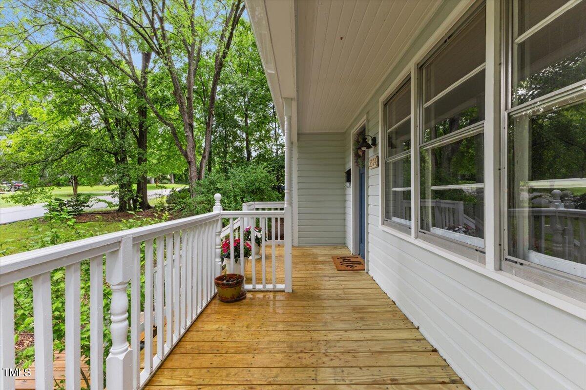 2324 Stevens Road Raleigh, NC 27610 - Photo 7 of 50 a view of balcony with wooden floor and fence