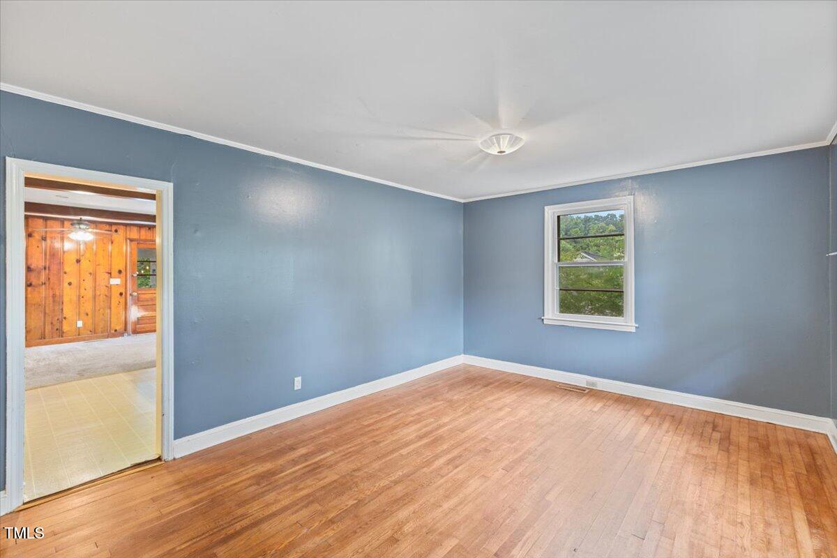2324 Stevens Road Raleigh, NC 27610 - Photo 8 of 50 wooden floor in an empty room with a window