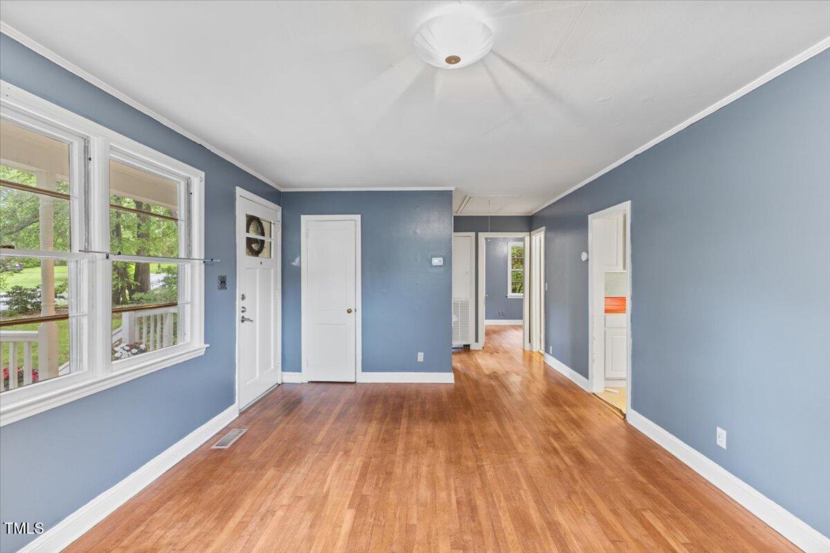 2324 Stevens Road Raleigh, NC 27610 - Photo 9 of 50 a view of a livingroom with wooden floor and window