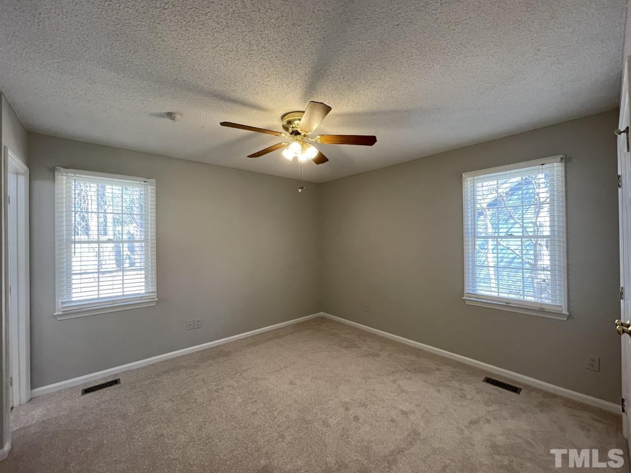 208 Crosspine Drive Raleigh, NC 27603 - Photo 18 of 40 Second door on left at the end of the hall. Windows look out to side and backyards.