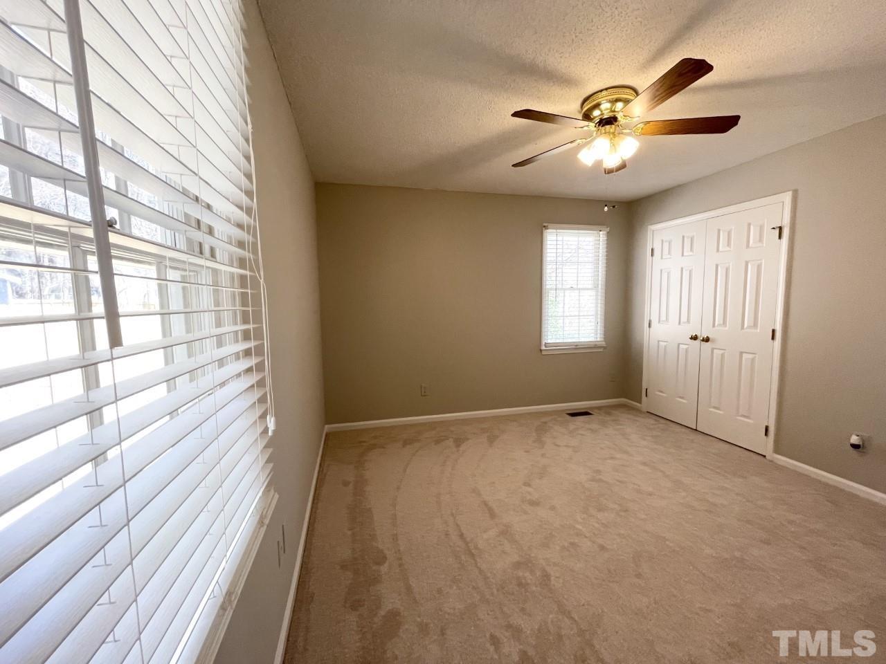 208 Crosspine Drive Raleigh, NC 27603 - Photo 19 of 40 View of closet doors in owner's suite.