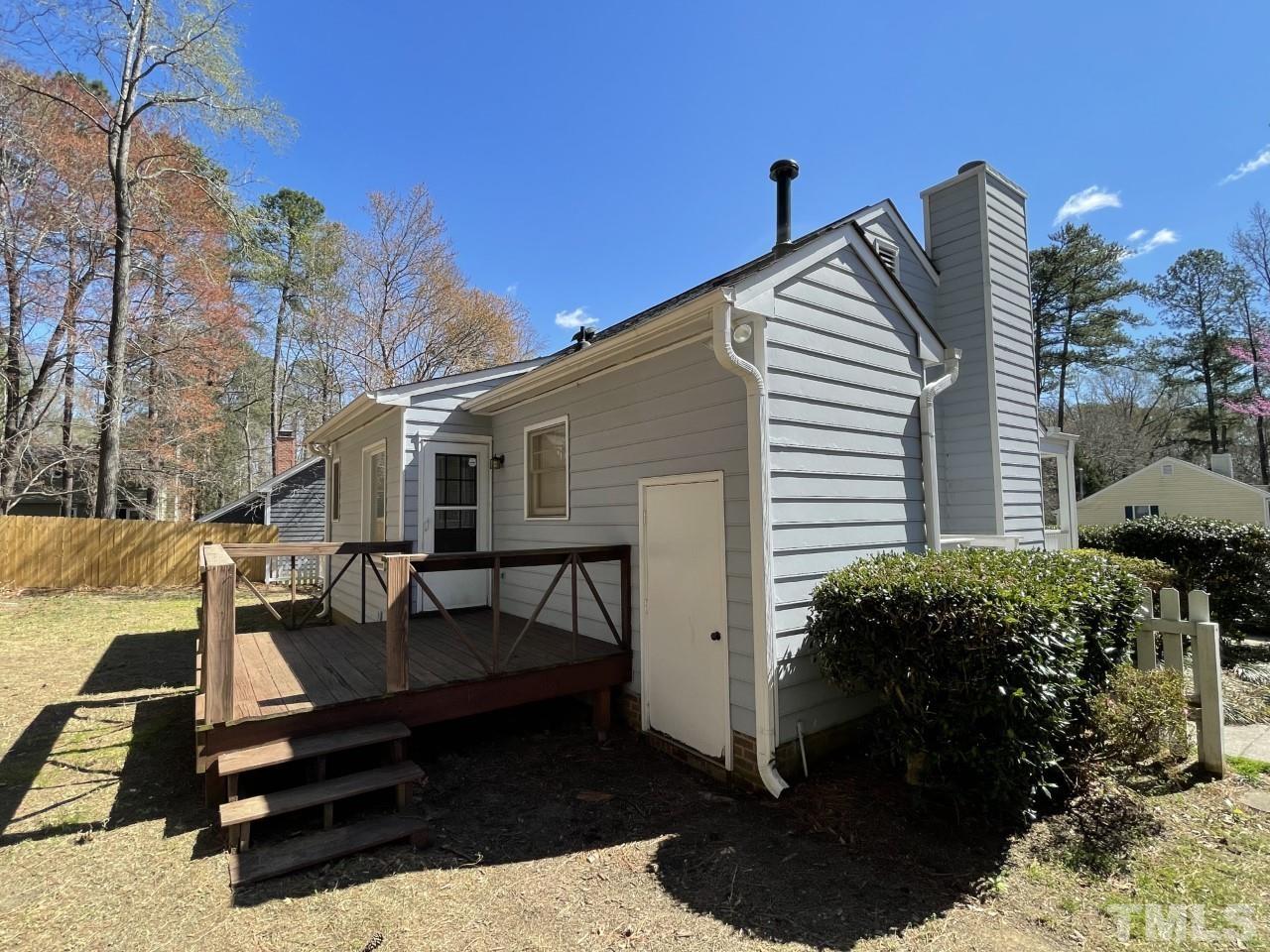 208 Crosspine Drive Raleigh, NC 27603 - Photo 26 of 40 Spend warmer evenings with a cool drink and great friends on your deck! The water heater is in the closet behind the white door.