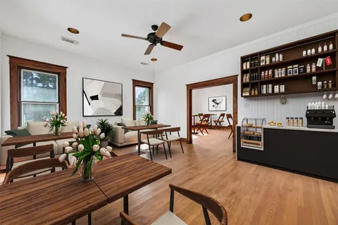 a view of a dining room with furniture window and wooden floor