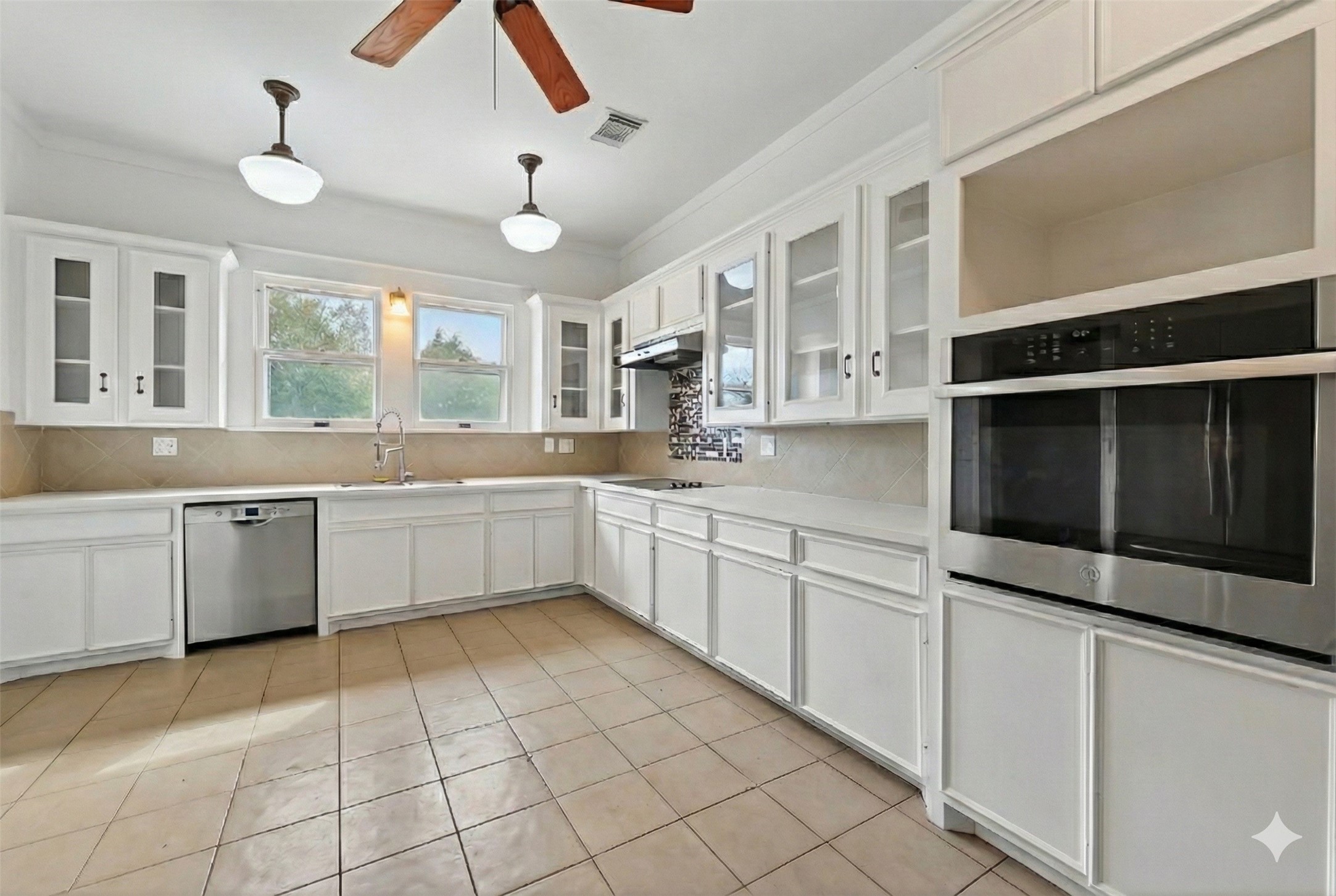 38011 Spur 149 Road Magnolia, TX 77354 - Photo 16 of 46 a kitchen with a sink cabinets and window