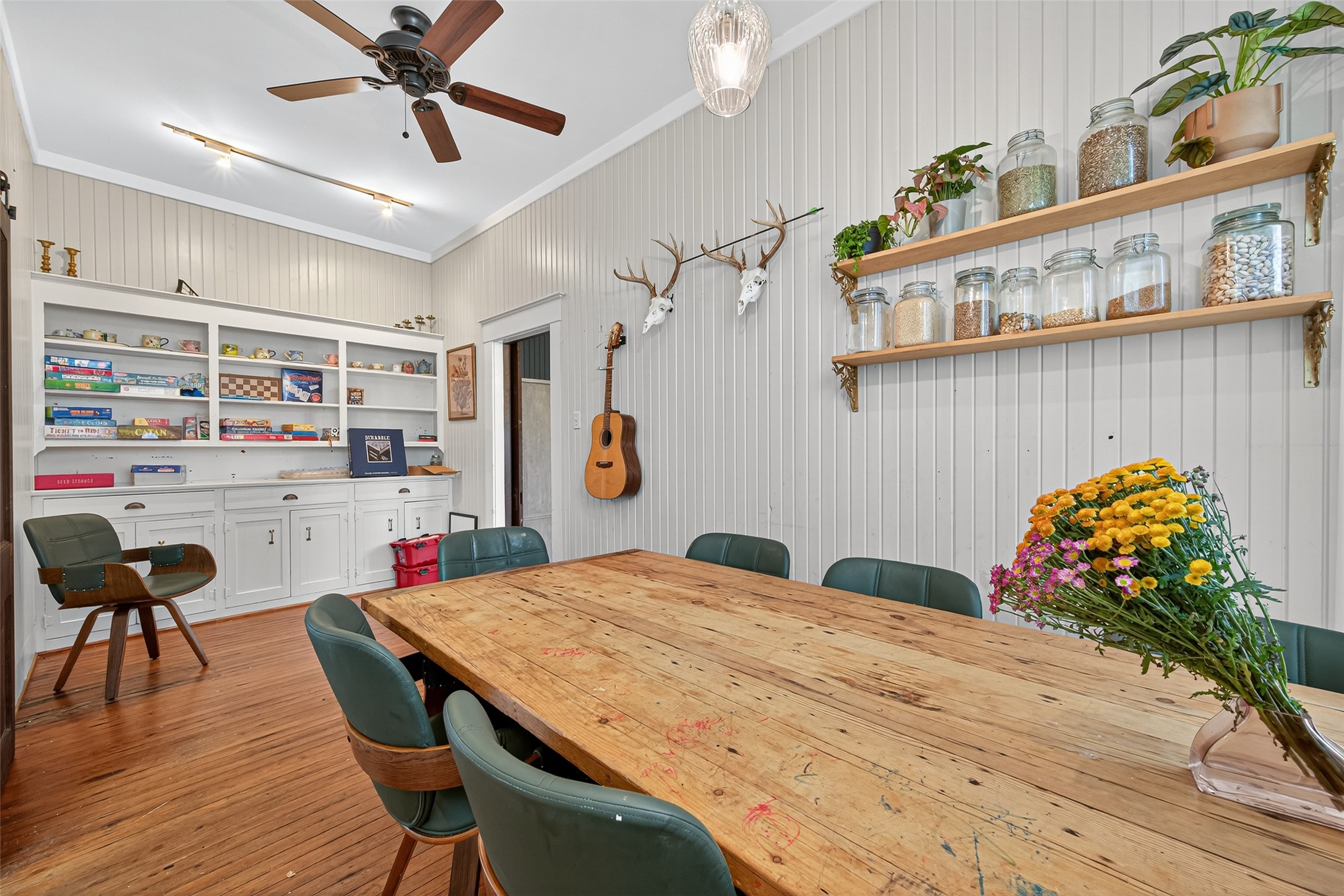 38011 Spur 149 Road Magnolia, TX 77354 - Photo 22 of 46 a dining room with furniture and wooden floor