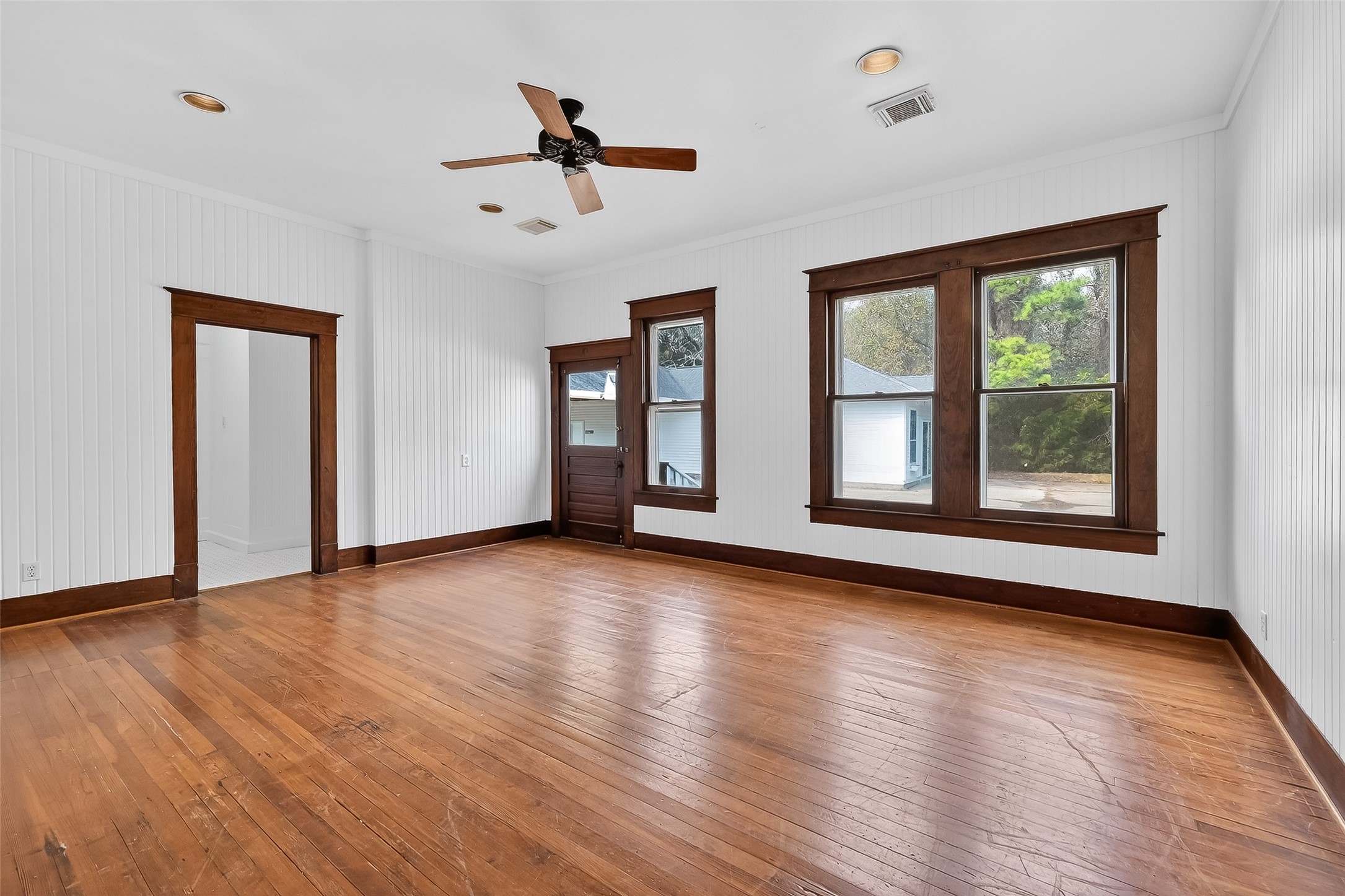 38011 Spur 149 Road Magnolia, TX 77354 - Photo 27 of 46 a view of an empty room with wooden floor and a window