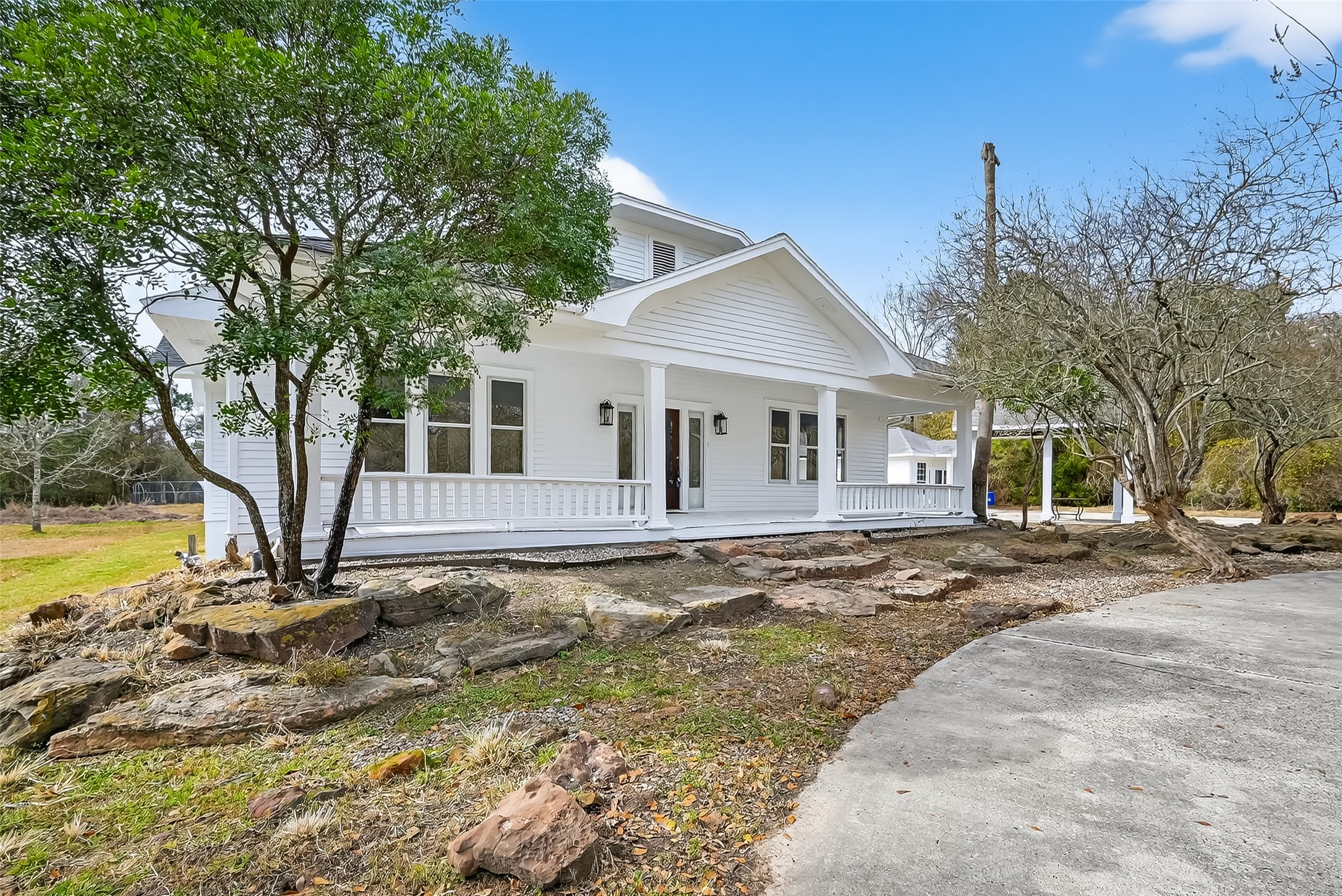 38011 Spur 149 Road Magnolia, TX 77354 - Photo 5 of 46 a front view of a house with a yard