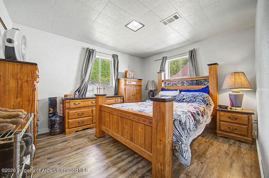 625 Russell Street Craig, CO 81625 - Photo 28 of 35 a bedroom with furniture and a window