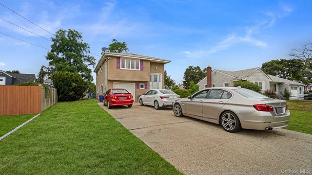 a view of a cars in front of a house