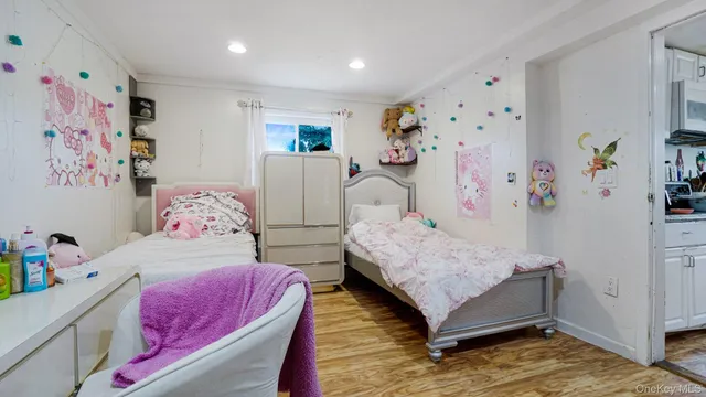 a bedroom with a bed and a couch