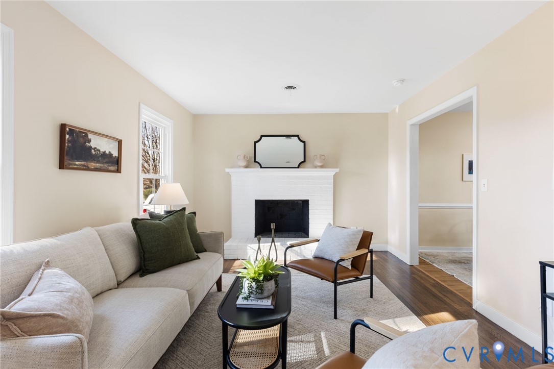 9924 Reams Road Chesterfield, VA 23236 - Photo 11 of 30 a living room with furniture a fireplace and a table