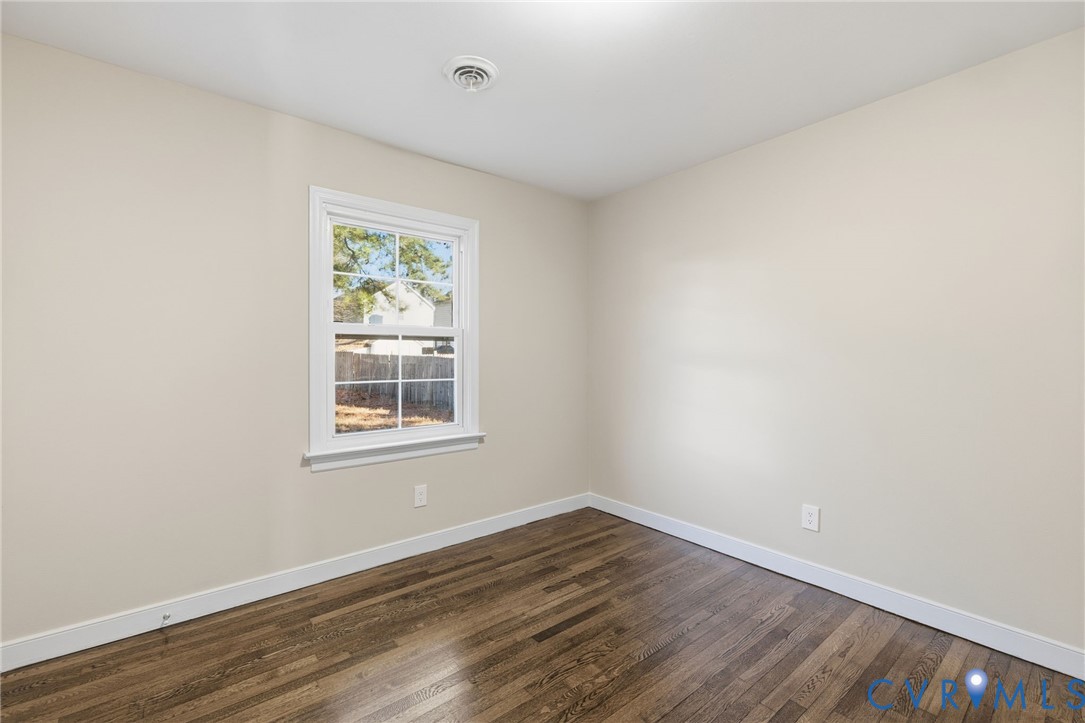 9924 Reams Road Chesterfield, VA 23236 - Photo 16 of 30 an empty room with wooden floor and windows