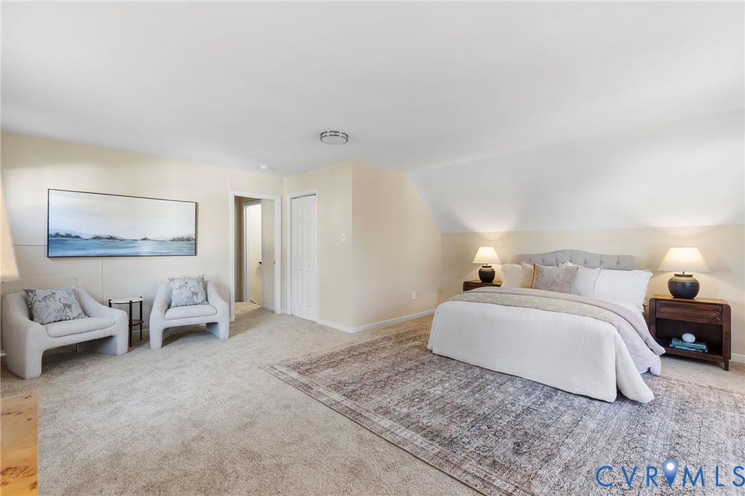 9924 Reams Road Chesterfield, VA 23236 - Photo 20 of 30 a spacious bedroom with a bed and couch