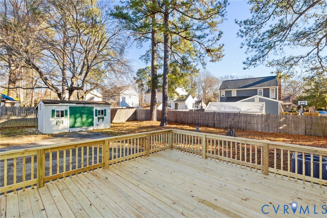 9924 Reams Road Chesterfield, VA 23236 - Photo 26 of 30 a view of a wooden deck and a yard