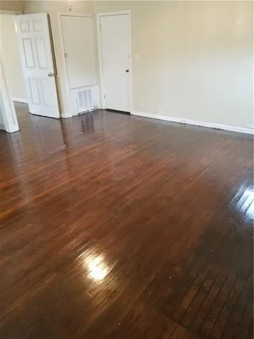a view of room and hardwood floor