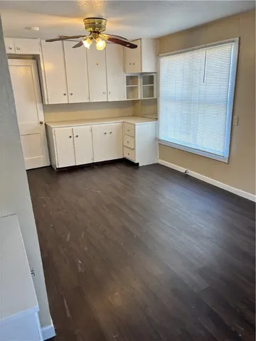 a view of a kitchen with electric appliances