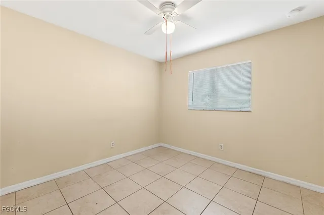 an empty room with a fan