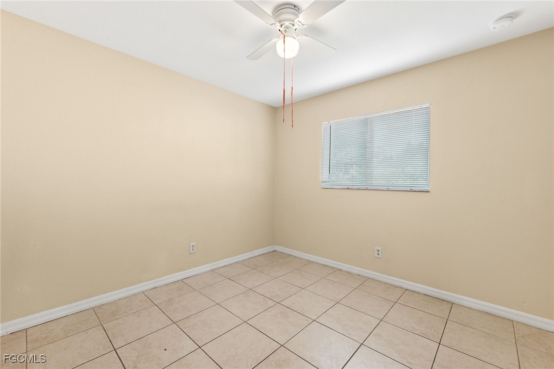 3733 16th Street West Lehigh Acres, FL 33971 - Photo 18 of 25 an empty room with a fan