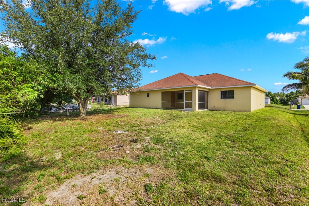 3733 16th Street West Lehigh Acres, FL 33971 - Photo 24 of 25 a front view of a house with a yard