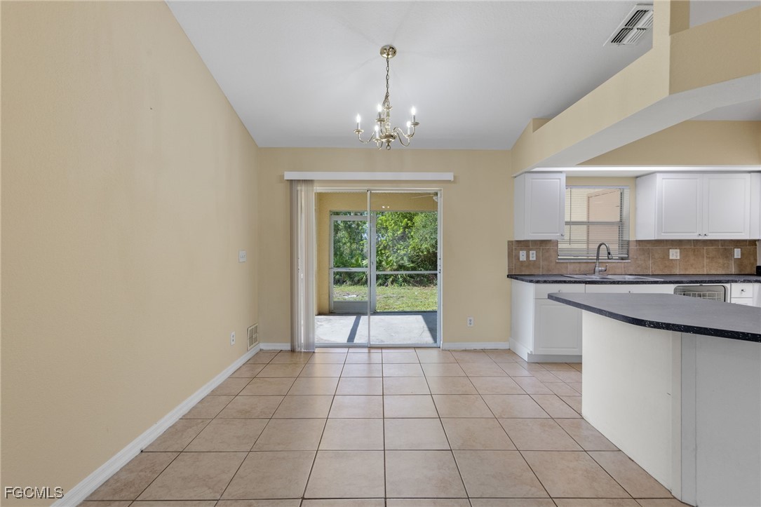 3733 16th Street West Lehigh Acres, FL 33971 - Photo 9 of 25 a view of an empty room with a kitchen