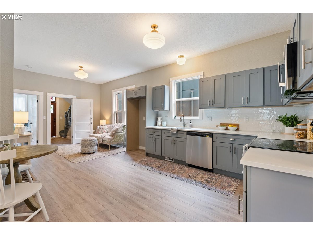 2115 Northwest 22nd Avenue Portland, OR 97210 - Photo 14 of 47 a kitchen with a refrigerator and a sink