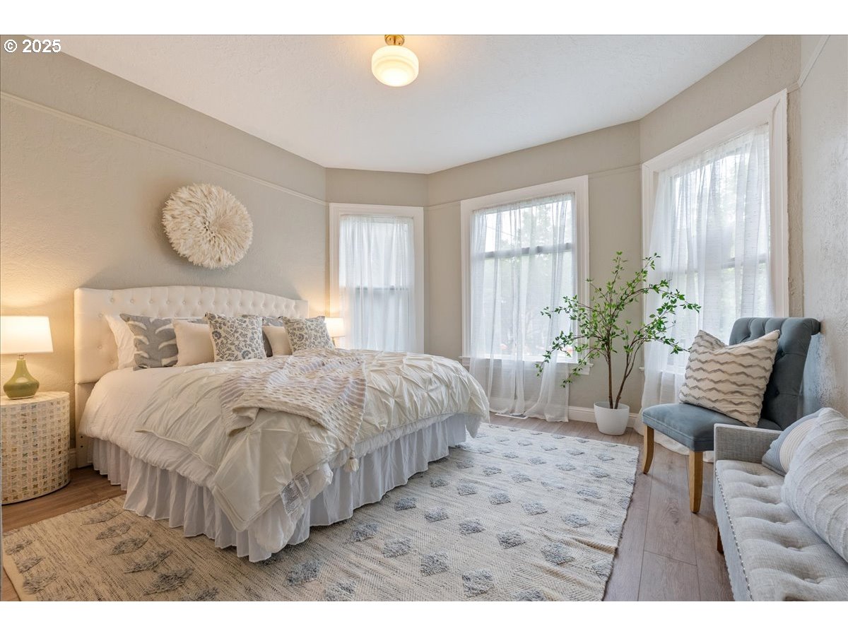 2115 Northwest 22nd Avenue Portland, OR 97210 - Photo 16 of 47 a bedroom with a bed and window