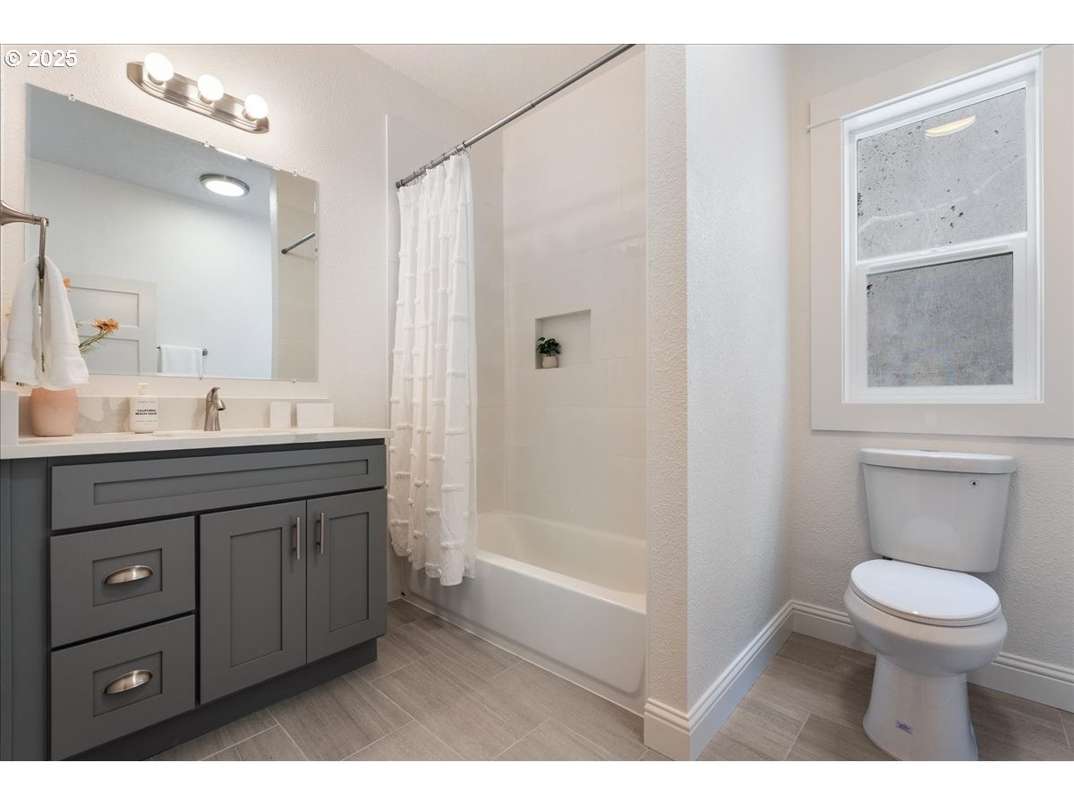 2115 Northwest 22nd Avenue Portland, OR 97210 - Photo 23 of 47 a bathroom with a sink a toilet and shower