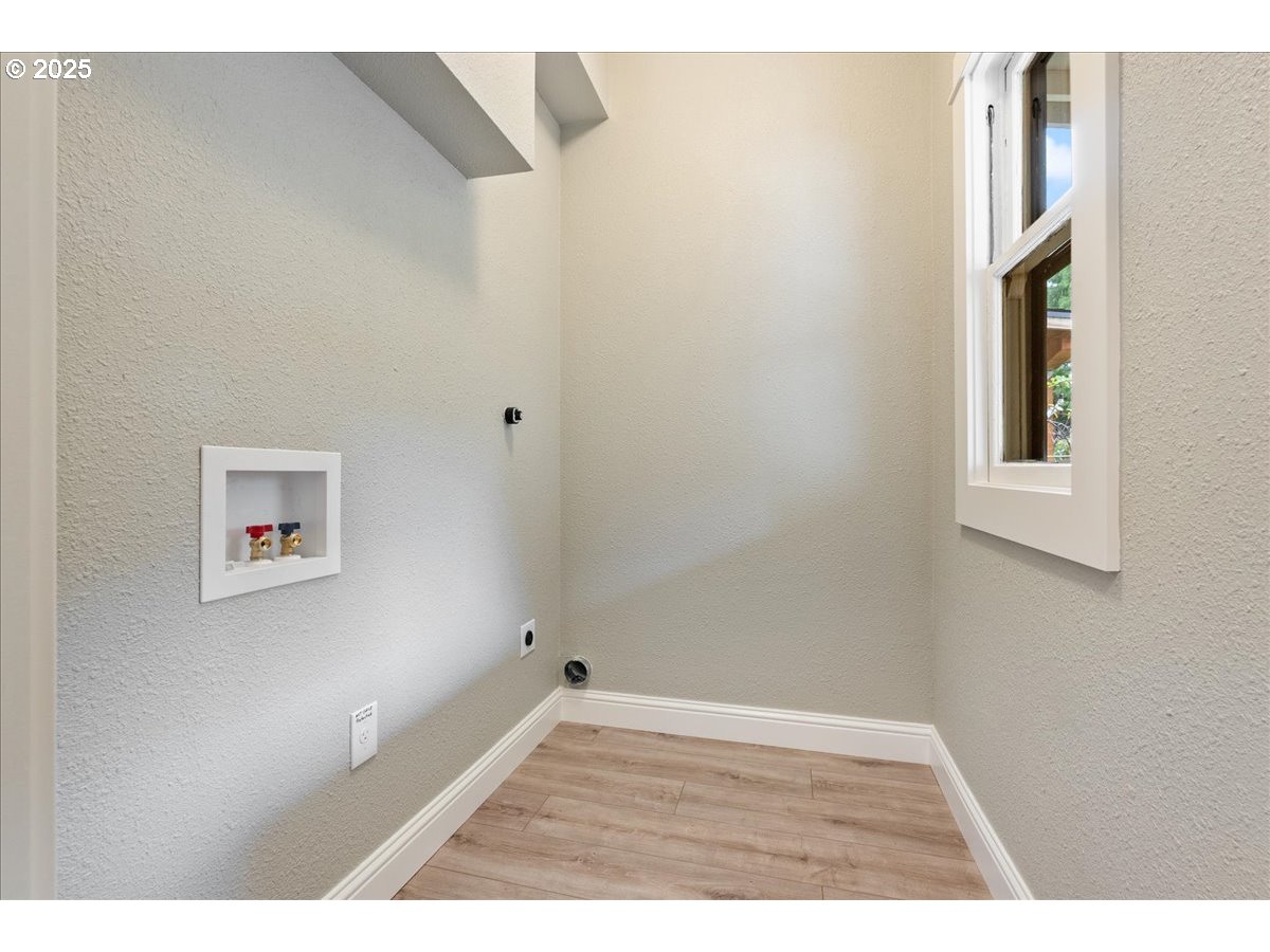 2115 Northwest 22nd Avenue Portland, OR 97210 - Photo 25 of 47 a view of an empty room with a window
