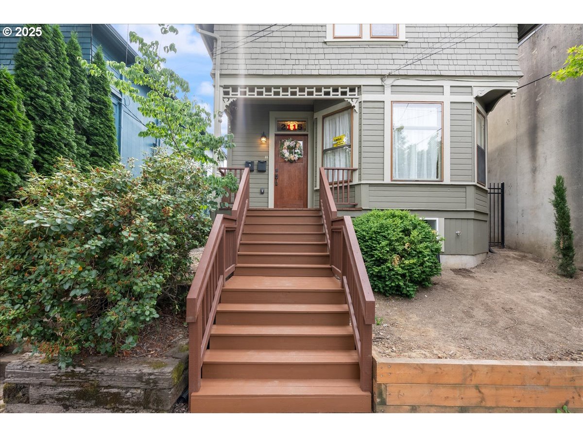 2115 Northwest 22nd Avenue Portland, OR 97210 - Photo 3 of 47 a view of a house with potted plants