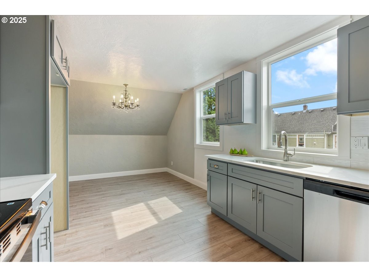 2115 Northwest 22nd Avenue Portland, OR 97210 - Photo 33 of 47 a kitchen with a sink and a window