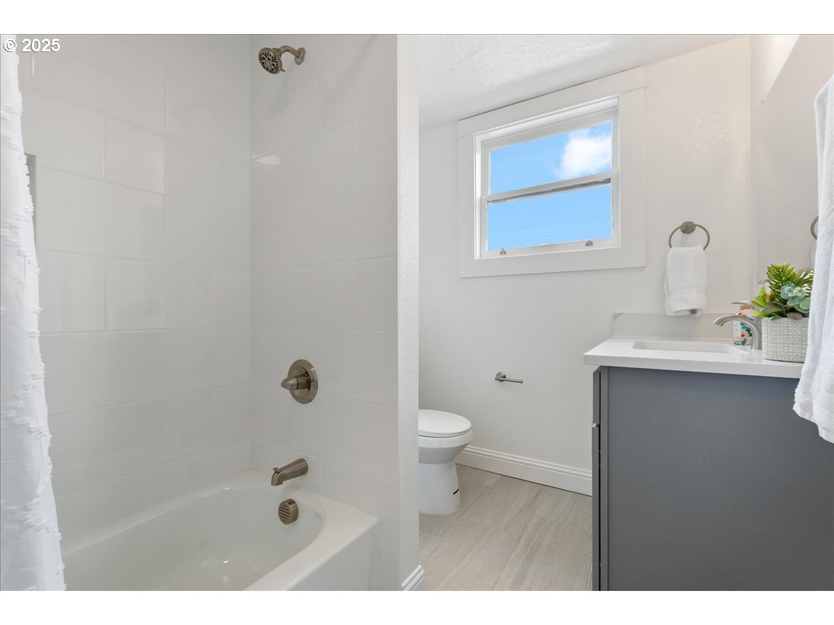 2115 Northwest 22nd Avenue Portland, OR 97210 - Photo 34 of 47 a bathroom with a sink a toilet and shower