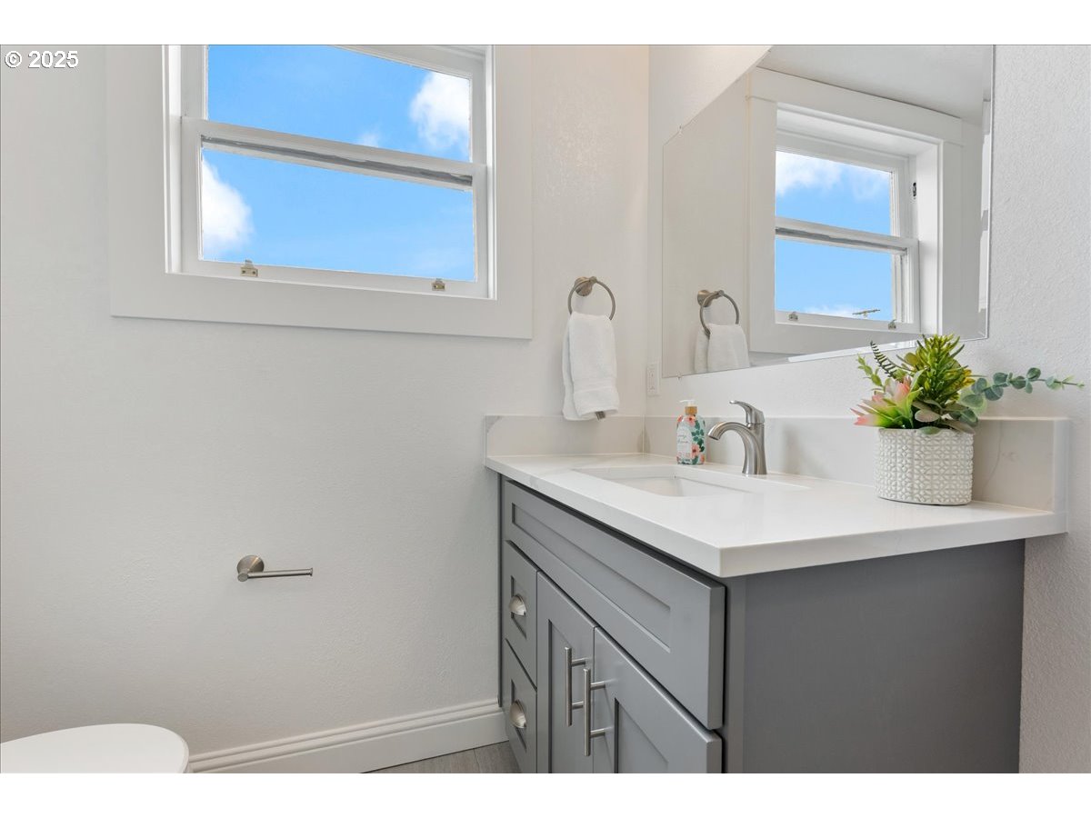 2115 Northwest 22nd Avenue Portland, OR 97210 - Photo 35 of 47 a bathroom with a sink vanity and a mirror