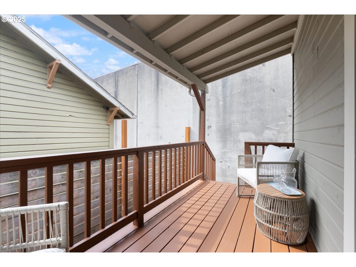 2115 Northwest 22nd Avenue Portland, OR 97210 - Photo 39 of 47 a balcony with wooden floor