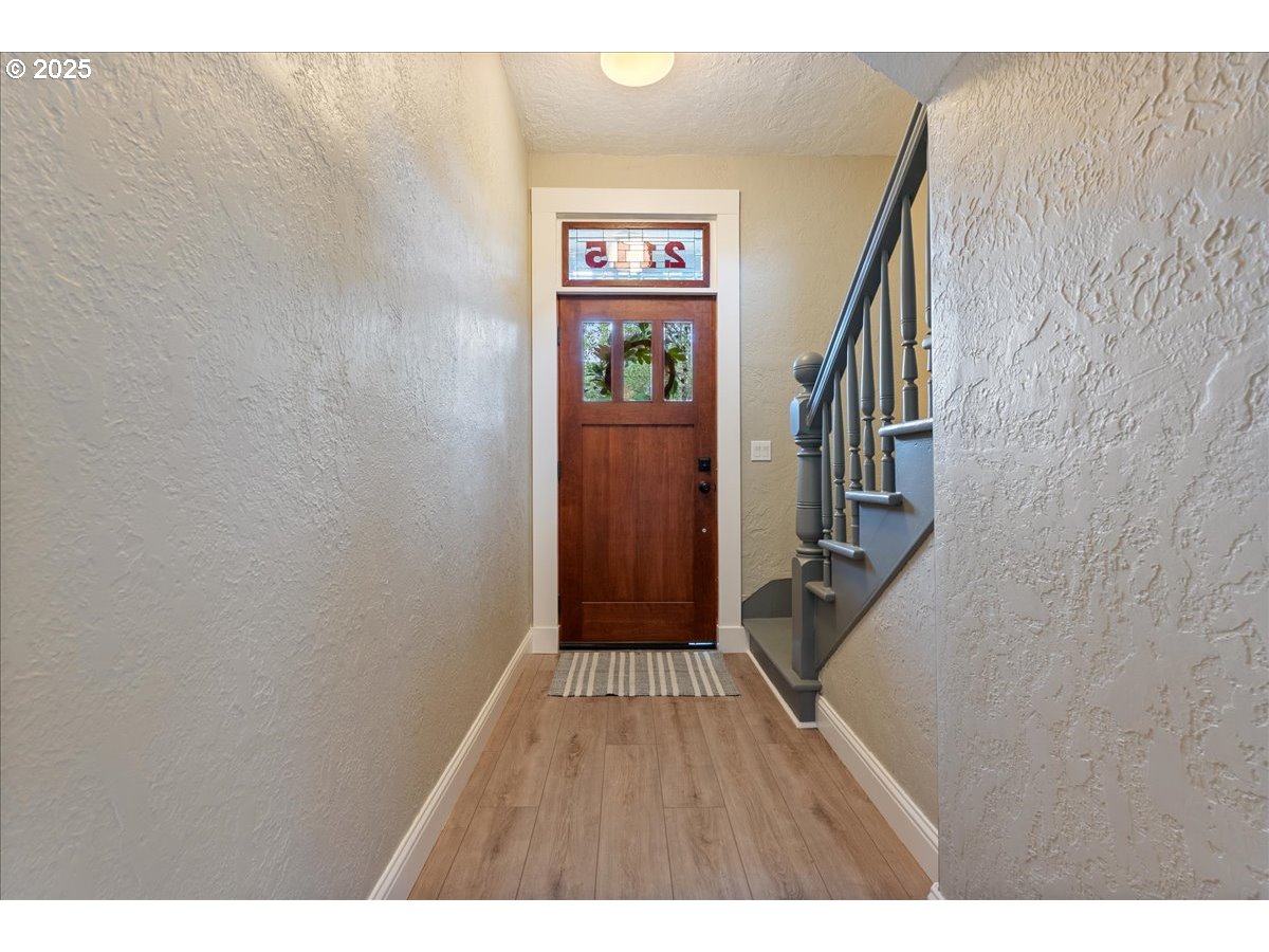 2115 Northwest 22nd Avenue Portland, OR 97210 - Photo 5 of 47 a view of an entryway with wooden floor
