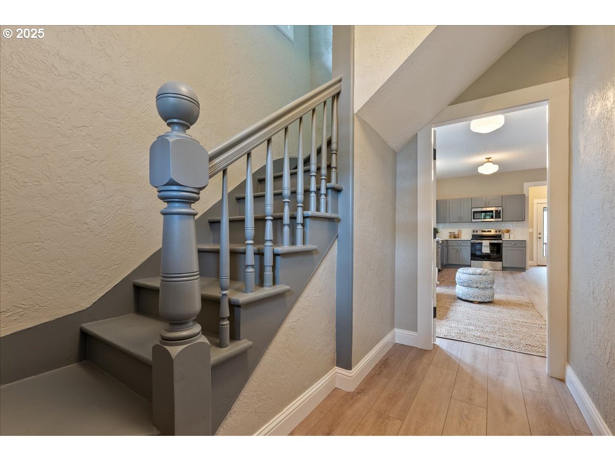 2115 Northwest 22nd Avenue Portland, OR 97210 - Photo 6 of 47 a view of a livingroom with furniture and staircase