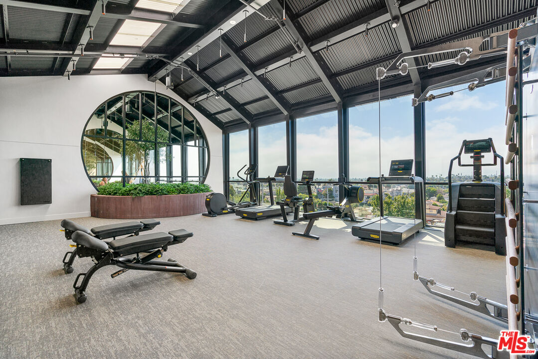 10700 Tabor Street, Unit 511 Los Angeles, CA 90034 - Photo 13 of 26 a view of a room with gym equipment