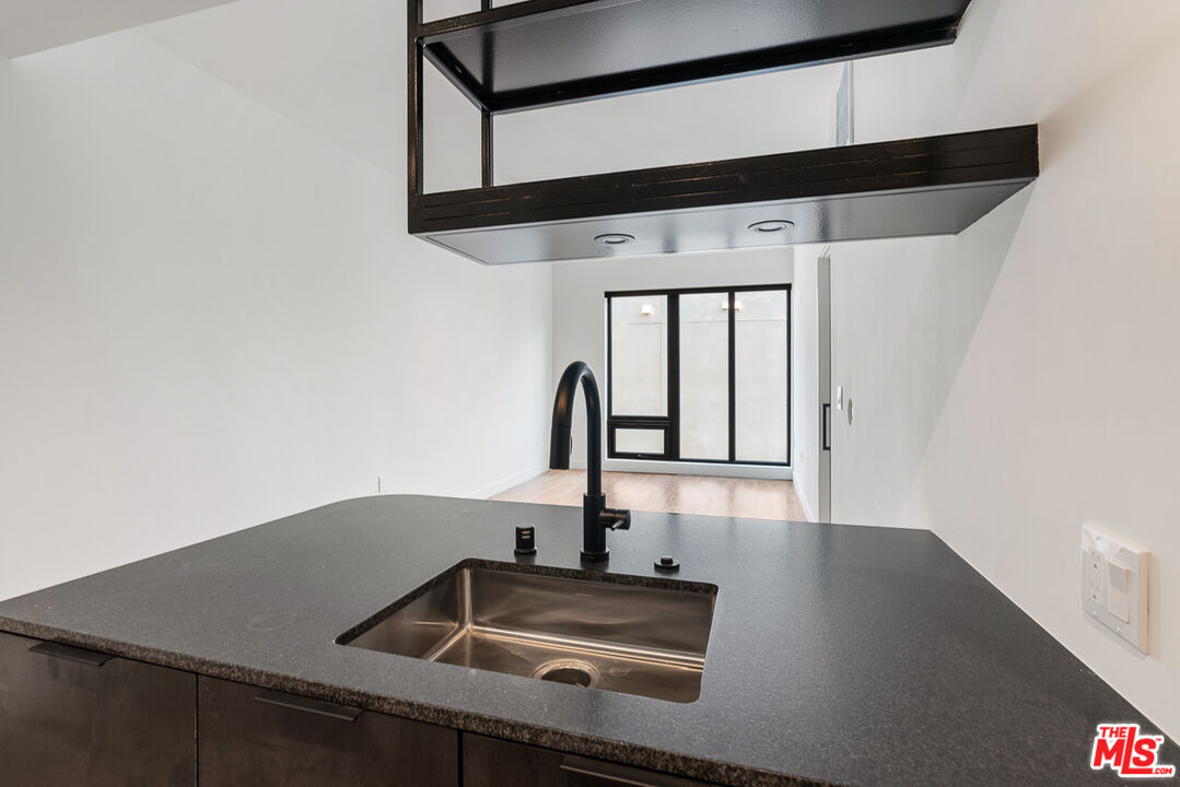 10700 Tabor Street, Unit 511 Los Angeles, CA 90034 - Photo 5 of 26 a kitchen with a sink and cabinets