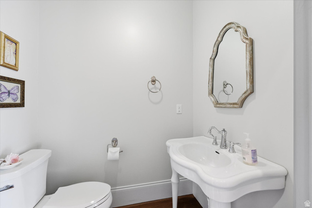 930 Price Farm Court Midway, UT 84049 - Photo 22 of 42 Half bathroom featuring toilet and beautiful fixtures