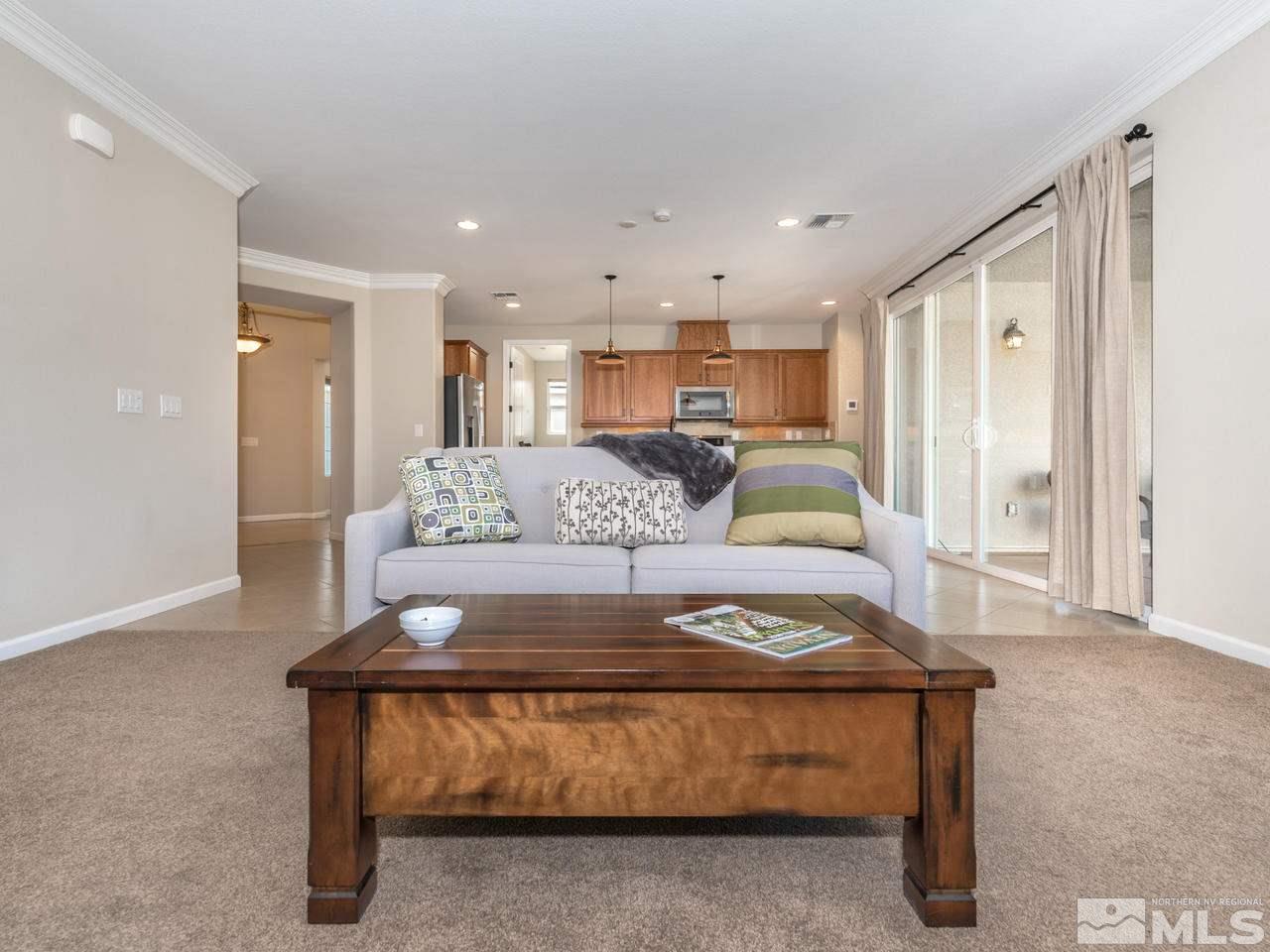 2180 Arpagos Lane Reno, NV 89521 - Photo 11 of 25 a living room with furniture and a wooden floor