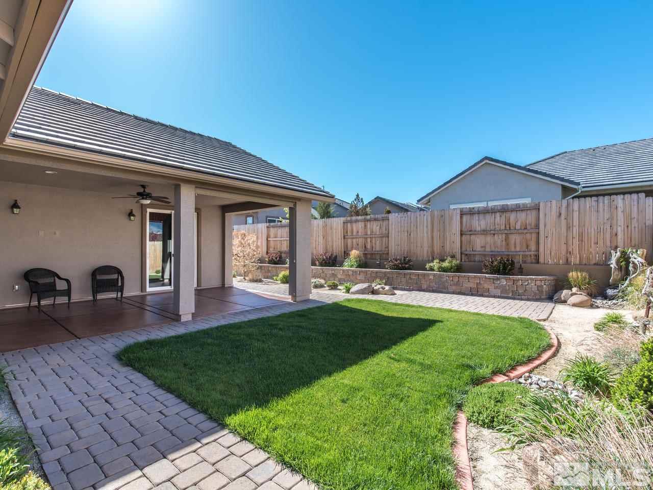 2180 Arpagos Lane Reno, NV 89521 - Photo 21 of 25 a view of a house with swimming pool and a yard