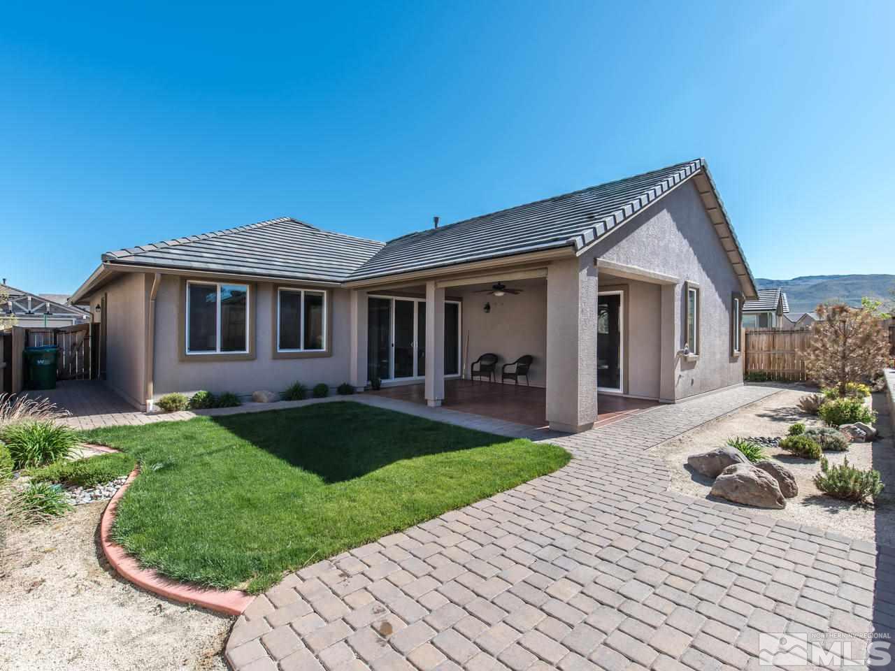 2180 Arpagos Lane Reno, NV 89521 - Photo 4 of 25 a front view of a house with a yard