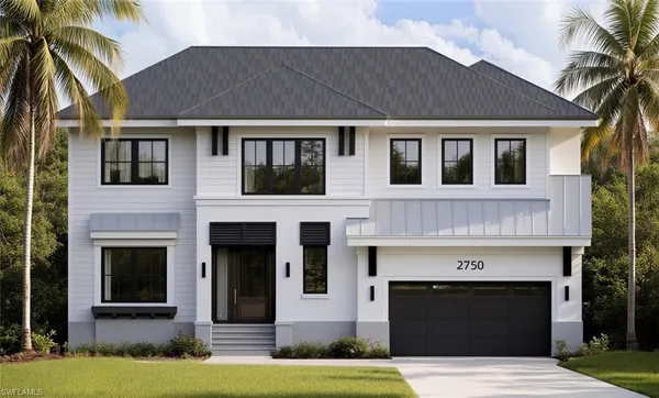 a front view of a house with yard and garage