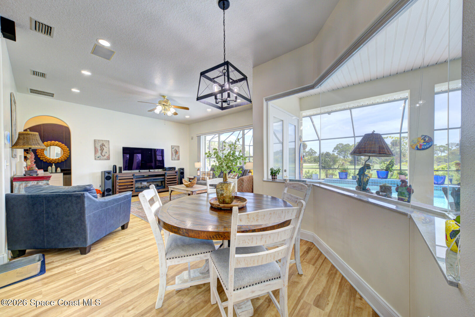 4056 Sand Ridge Drive Merritt Island, FL 32953 - Photo 40 of 69 breakfast nook with pool view
